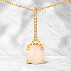 0.53 Carat Genuine Ethiopian Opal and White Diamond 10K Yellow Gold Pendant
