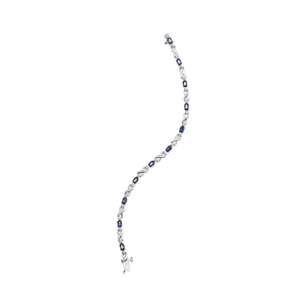 10K White Gold 5x4mm Oval Sapphire Gemstone and 1/10 Cttw Diamond Prong Set "X" Link Bracelet - Size 7" (H-I Color, SI1-SI2 Clarity)