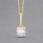0.53 Carat Genuine Ethiopian Opal and White Diamond 10K Yellow Gold Pendant