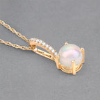 0.53 Carat Genuine Ethiopian Opal and White Diamond 10K Yellow Gold Pendant